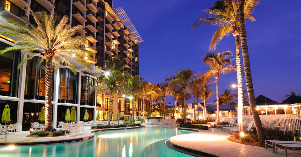 hotel pool with palm trees